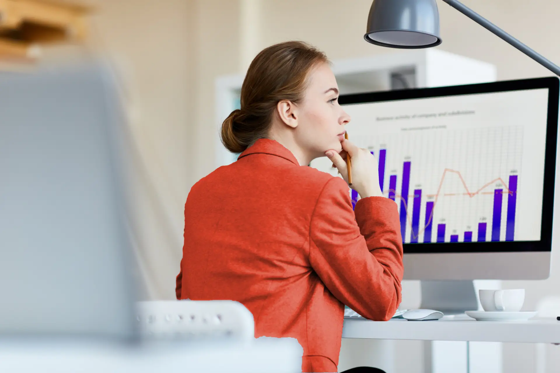 Employee doing predictive analysis at her computer.